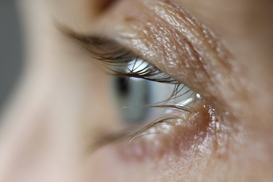 a close up of a person's blue eye